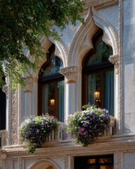 Close-up of Venetian Gothic windows with ornate details and flower boxes