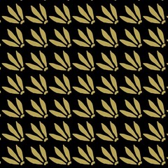 Leaf pattern design in gold on black background  