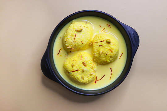 Rasmalai is a soft, spongy dessert made from chenna or paneer. soaked in creamy saffron milk, garnished with chopped pistachios and almonds. A festive Indian sweet, chilled and served in syrup.
