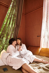 Young couple enjoying a peaceful moment together in a cozy retreat surrounded by nature