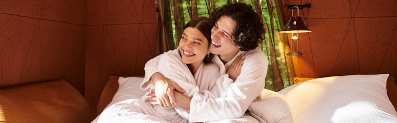 Young couple enjoying tender moments in a cozy retreat surrounded by natures tranquility
