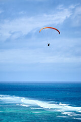 paraglider over the sea