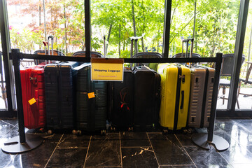 Luggages gathered in hotel for transport company to pickup and send to destination location....