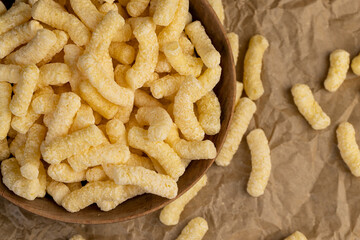 corn sticks for eating or making breakfast with milk, corn sticks in a wooden bowl, closeup