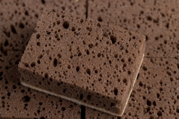 brown sponge for washing dishes and other objects, a synthetic sponge with lots of holes for good foaming of detergents and is used for cleaning