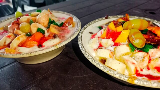 Fresh Fruit and Yogurt Parfait,mix colourful fruit salad,tow bowls of fruit salad, grapes, mango, Apple, banana,mix fruit chat,World food day,3d food photography,16th October