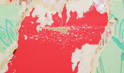 Old torn wallpaper on the wall.Old wallpaper for texture or background.