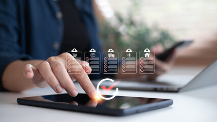 Close-up of a woman using a tablet with digital checklists for shopping, shipping, logistics, healthcare, travel, and real estate. Concept of task management, productivity, and digital workflow tools.