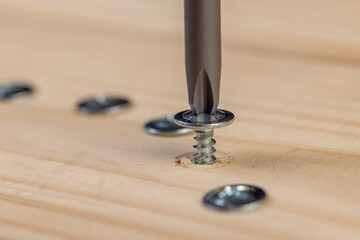 pine board and steel screws , silver self-tapping screws for wood on the board