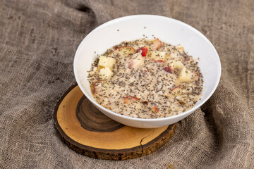 quickly cooked oatmeal porridge with fruits and berries and lots of chia seeds
