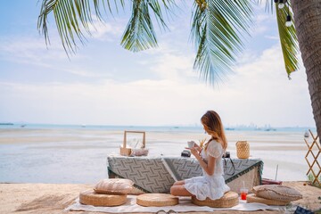 Relaxing seaside afternoon with a warm drink and tropical view in a serene beach setting