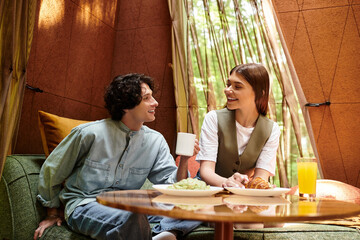 Joyful moments of a young couple enjoying a cozy afternoon in a serene park setting