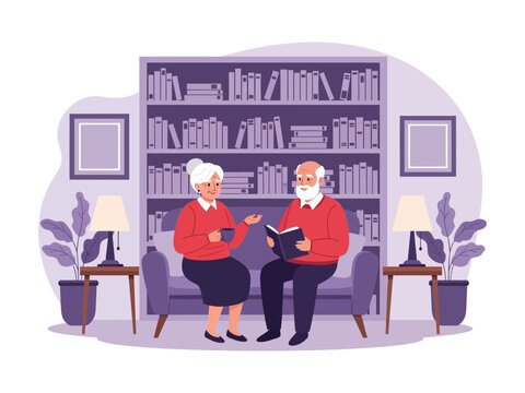 An elderly couple relaxes on a sofa in their home library, the man reading a book while the woman listens.