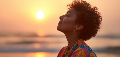 The woman enjoying a serene moment at sunset on the beach.