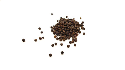 Black pepper on a white background.