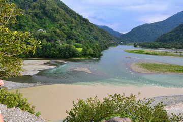 confluence of two rivers in the mountains