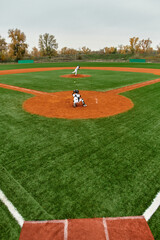 Teen boys play a friendly baseball game on a sunny afternoon