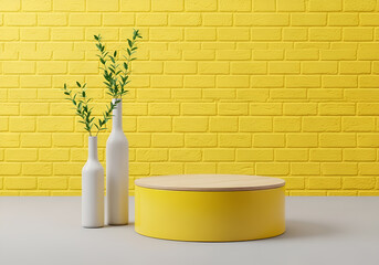 Bright yellow circular platform and white vases with greenery against a textured yellow brick wall