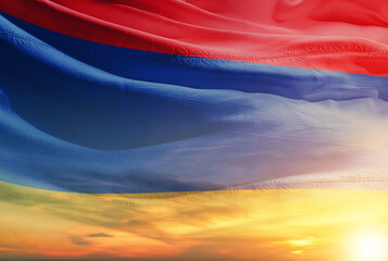 Armenia national flag waving in sunny sky with beautiful sunset. Armenia national flag for independence day.