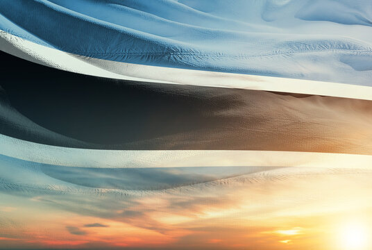 Botswana national flag waving in sunny sky with beautiful sunset. Botswana national flag for independence day.
