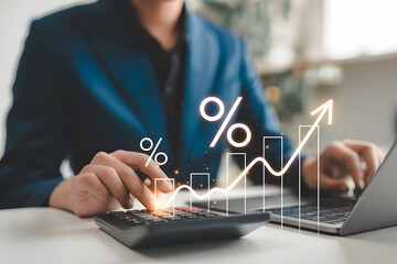 Close up of a person in a suit using a calculator and laptop with a glowing financial graph and percentage symbols indicating growth and profit