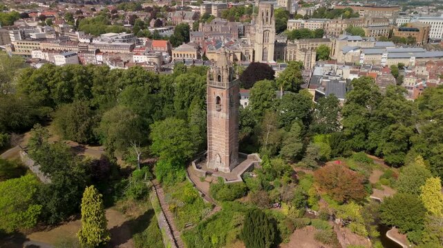 Bristol UK: 28th July 2025: Breathtaking drone view of Cabot Tower surrounded by lush greenery of Brandon Hill park. With University of Law in background