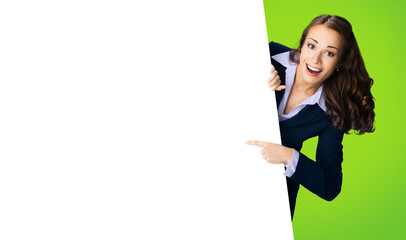 Happy smile woman in black confident suit, peep out show pointing advertise blank white banner...