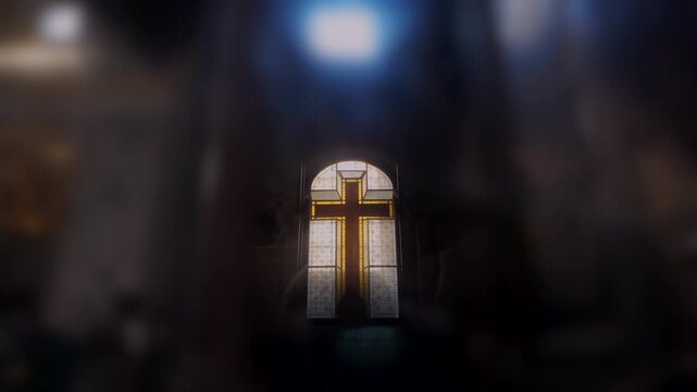 Golden stained glass cross window in cathedral interior with divine light from above, symbolizing Christian faith, sacred architecture, and spiritual devotion - Powered by Adobe