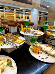 All-Inclusive Food Display in Hotel Dining Area. Various snacks, types of cheese