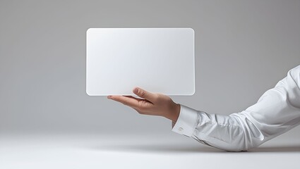 Hand holding blank card on isolated background