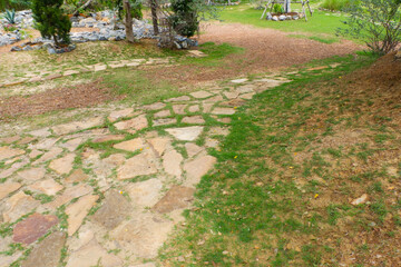 Garden landscape design with pathway in garden and footpath in picturesque summer park and...