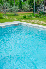 Empty swimming pool with sunbed and white umbrella in resort hotel for vacation leisure and white sand,resort neary sea and beach in summer.