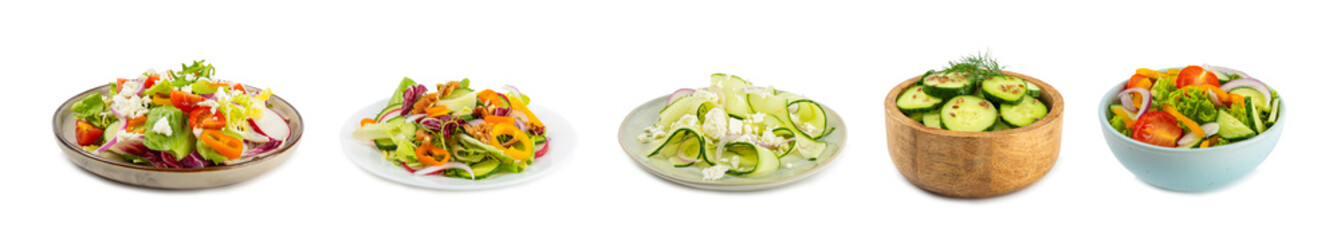 Cucumber salad isolated on white background. Homemade salad with fresh vegetables, cucumber, tomato, sweet pepper and lettuce in a plate. Vegetarian spring salad. Vegetarian diet. Healthy eating.