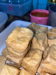 crispy fried tofu served on a plate