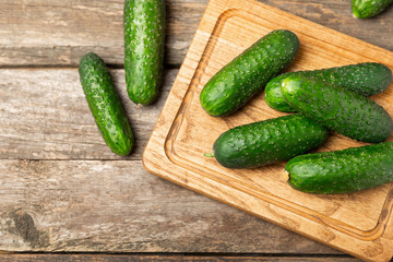 Cucumber on wooden background. Slice of cucumber on background. Fresh organic green cucumbers...