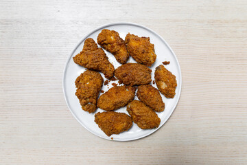A plate of spicy fried chicken wings.