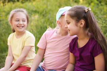 Children spending time in nature on summer day, selective focus
