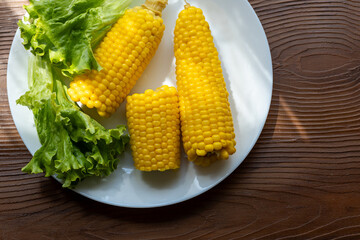 Close-up of boiled corn on a white plate