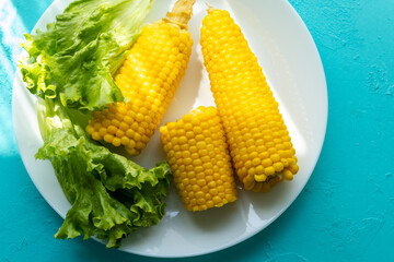 Close-up of boiled corn on a white plate