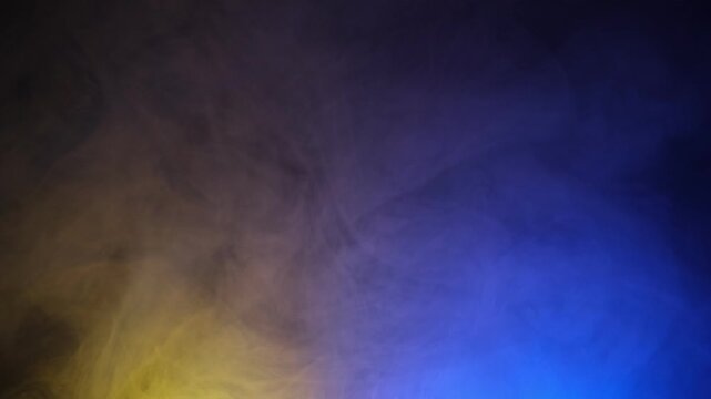 Yellow and blue smoke gradient abstract background slow motion