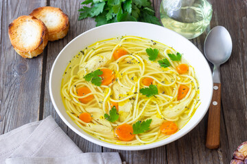 Noodle soup with chicken, carrots and greens. Healthy eating. Diet.