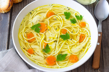 Noodle soup with chicken, carrots and greens. Healthy eating. Diet.