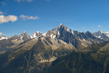 Stunning mountain range near Chamonix in the French Alps under clear blue sky. Jagged peaks, rocky...