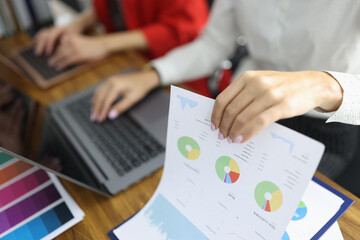 Collaboration in a modern office during a business meeting focused on data analysis and presentation of results