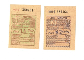 Fototapeta premium Vintage petrol coupons from The United Kingdom dated 1974 on a white background.