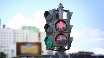 Vibrant city intersection with pedestrian signal highlighting countdown to crosswalk readiness