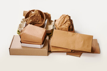 Sorting garbage for recycling on white background. Cardboard waste segregation, paper waste...