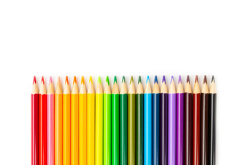 Colored pencils isolated on white background. Equipment for coloring. Stationery for creativity.Back to school. Flatlay. Children's Creativity and Education. Rainbow.