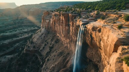 Dramatic waterfall cascading down a canyon wall.