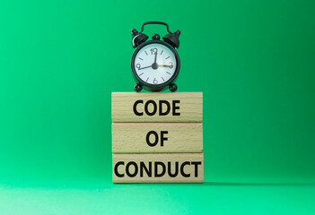 Code of conduct symbol. Wooden blocks with words Code of conduct with alarm clock. Beautiful green...